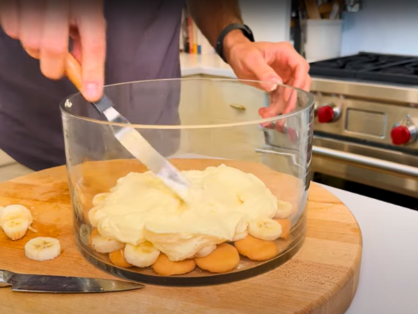 Start with a layer of vanilla wafers at the bottom of the dish.