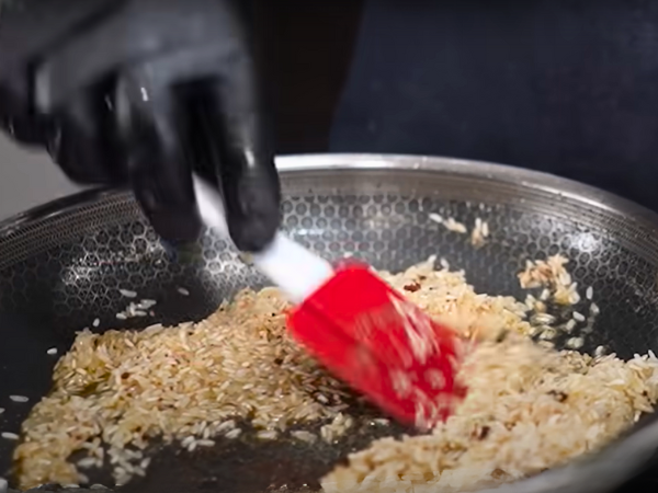 Toast the Rice: Add the rinsed rice to the pot. Stir and cook until the rice is lightly toasted, about 2-3 minutes.