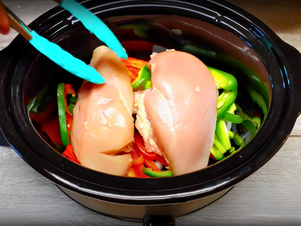 Crockpot Chicken Fajitas Recipe - Place the whole chicken breasts directly into the crockpot.