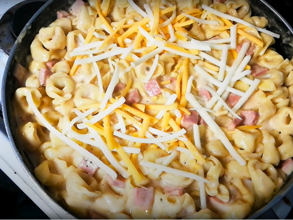 Mac And Cheese With Tortellini Step by Step Recipe -  Add an additional ½ cup of shredded mozzarella and ½ cup of shredded cheddar on top.