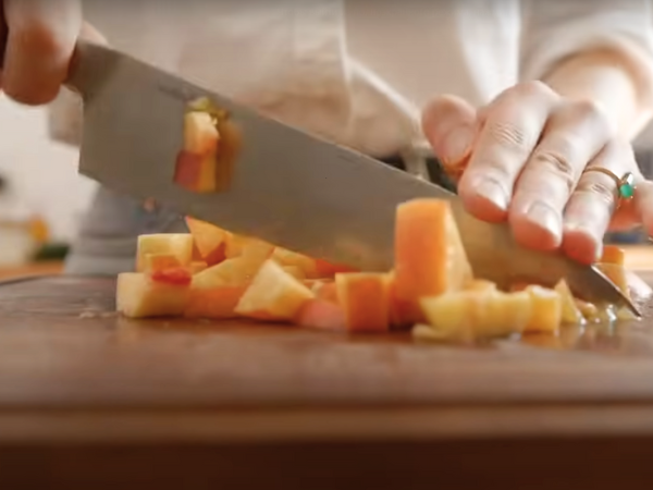 Peach Bread Recipe -  Use a sharp knife to cut the peaches into small, uniform pieces.