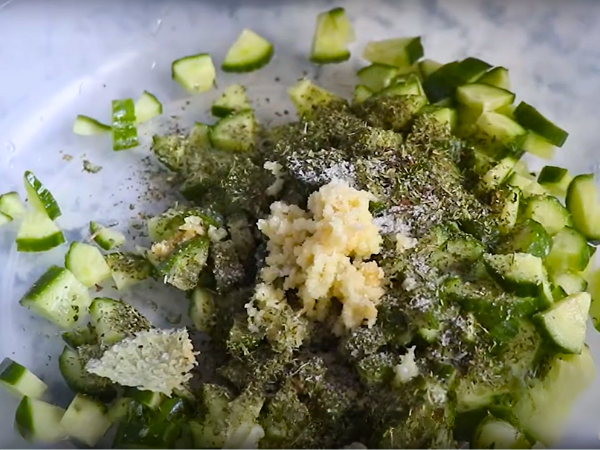 Gently toss the cucumbers, garlic, and dried mint together.