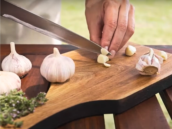 Use a chef's knife to chop the garlic finely.