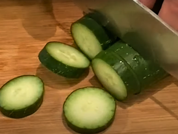 Recipe Korean Cucumber Salad (Oi Muchim) - Slice the cucumbers into thin rounds. Try to make each slice about 1/8 inch thick.