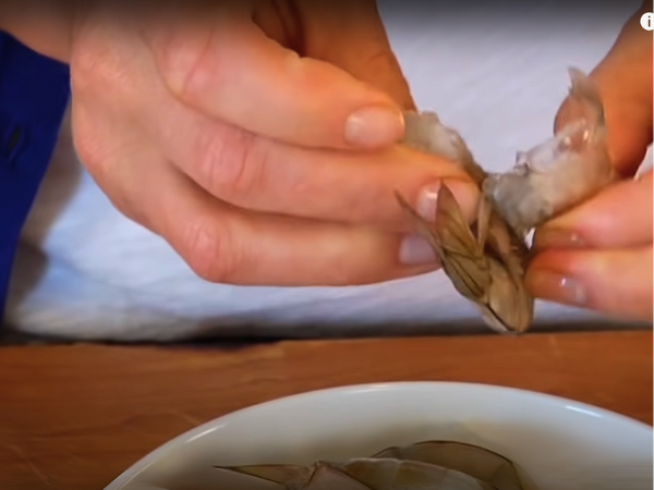 Devein the shrimp by making a shallow cut along the back and removing the dark vein using a knife or toothpick.