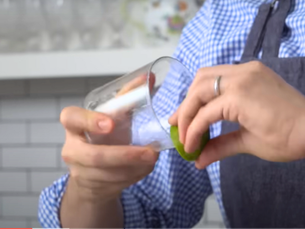 Rub a lime wedge around the rim before dipping it into the salt.