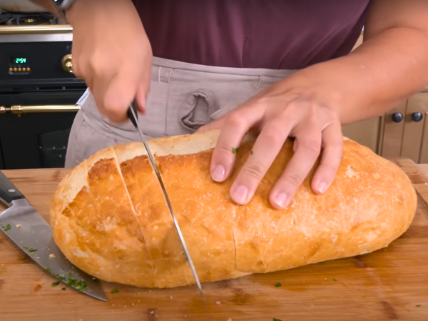 Using a sharp knife, make diagonal cuts across the top of the dough, about 1 inch apart.