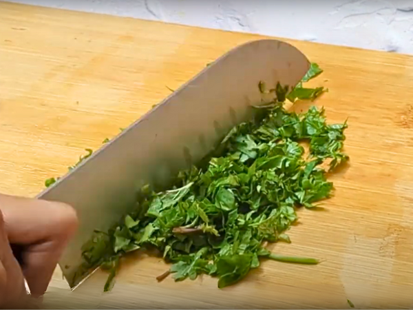 Vietnamese Cucumber Salad Recipe - Stack the leaves of each herb, roll them into a tight bundle, and chop finely with a sharp knife using a rocking motion.