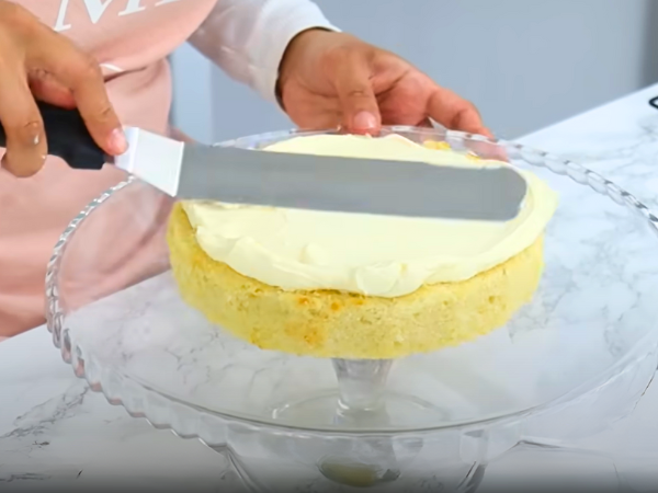 recipe Classic Vanilla Cake - Divide the batter evenly between the prepared pans. Smooth the tops with a spatula.